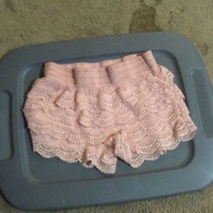Pink with little holes in and stretchy top
